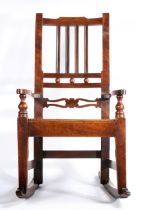 An early 19th century fruitwood, mahogany and alder wood child’s rocking chair, East Anglia, circa