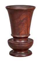 A fine and large turned lignum-vitae urn, English, circa 1820-40 Having a flared drum, on a squat-