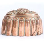 A Victorian Benham & Froud copper jelly mould, circa 1850 Of oval lobed form, surmounted by an