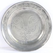 A Queen Anne/George I pewter single reed rim and wrigglework plate, circa 1710-25 The rim
