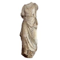 An 18th Century marble figure, modelled as a lady wearing a flowing robe, 140cm high