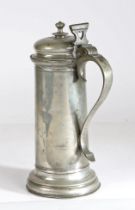 A large and impressive Charles I pewter flagon, circa 1630 Having a plain drum with ovolo footrim,