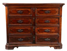 A solid walnut chest of drawers, Italian, circa 1700 Having an impressive one-piece top, with canted
