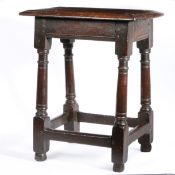 A Charles I oak joint stool, circa 1640 Having a triple-moulded top, plain rails with lower