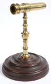 An unusual George III cast brass goffering iron with rare original mahogany base, circa 1790 The