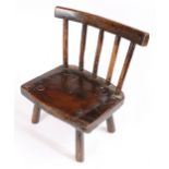 A George III ash and possibly elm child's stick-back chair, Welsh, circa 1800-20 The back of five