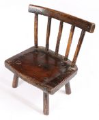 A George III ash and possibly elm child's stick-back chair, Welsh, circa 1800-20 The back of five