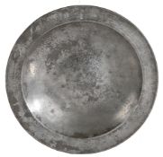 A rare and fine mid-16th century pewter dish, English, circa 1550 The plain rim with triangular