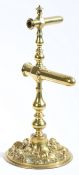 An unusual and strikingly designed Victorian cast and repouseé brass double-barrelled goffering