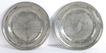 A pair of George I pewter single reed plates, circa 1715 Each later engraved across the centre of