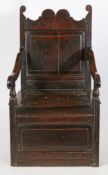 A Charles II oak box-seat open armchair, North Country, circa 1680 Having a rectangular fielded back