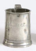 An early 19th century pewter Imperial pint mug, circa 1830 The truncated cone body with reeded and