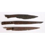 Three 15th-16th century excavated iron knives The first with a tapering blade and nagel guard,