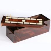 A 19th century mahogany game box, English, circa 1820-50 The underside of the sliding lid a cribbage