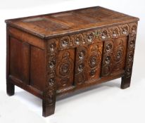 A Charles I joined oak coffer, West Country, circa 1640 Having a triple-panelled lid, the front