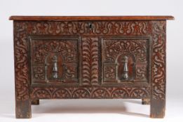 An Elizabeth I oak coffer, West Country, circa 1600 With triple-panelled hinged top, the front with