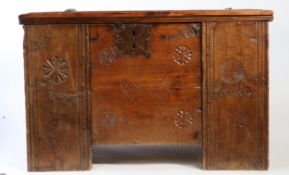 A 17th century, or possibly earlier, pine clamp-front chest The lid of three boards with moulded