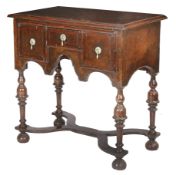 A William & Mary walnut side or dressing table, circa 1690 and later The quarter-veneered burr