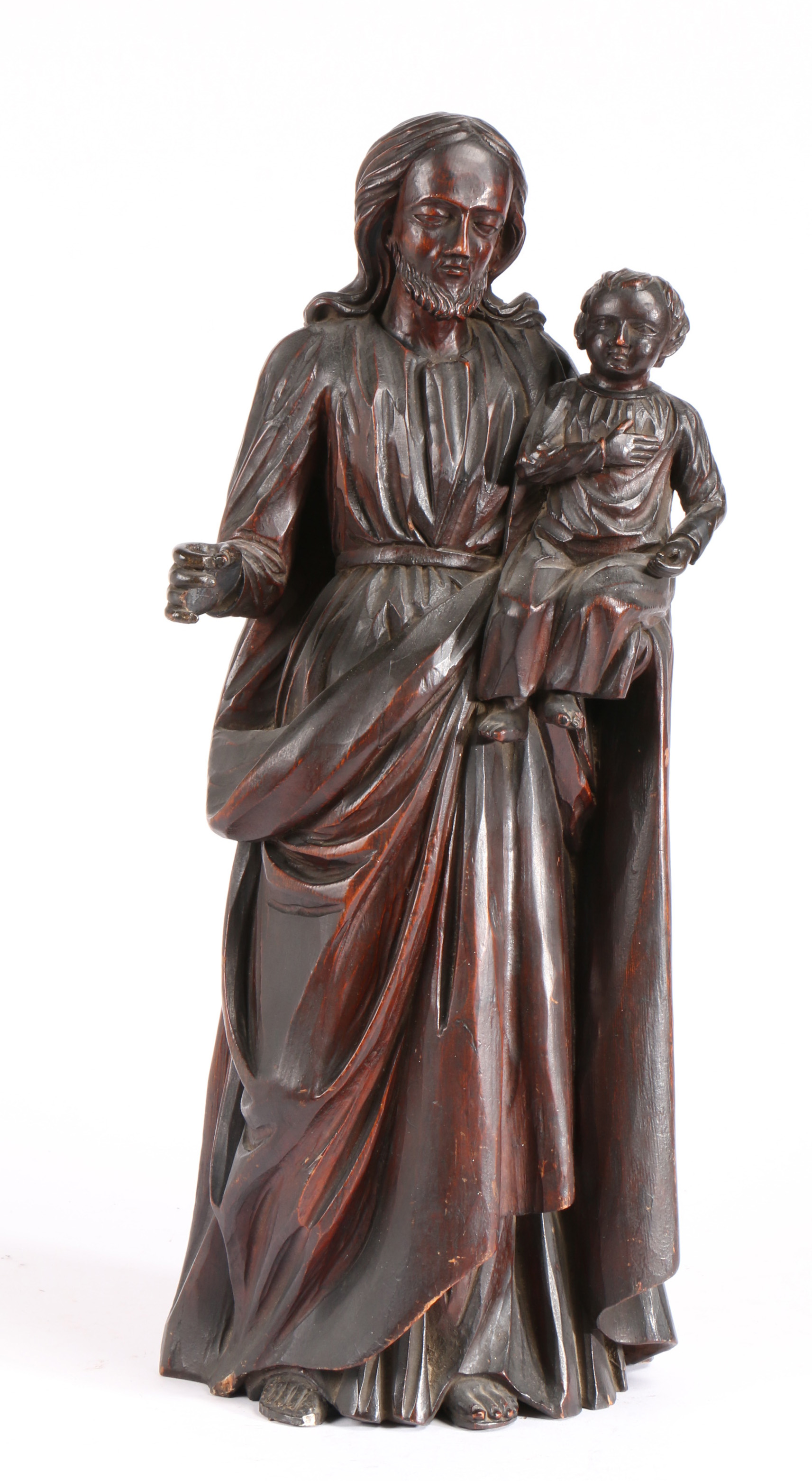 An early 19th century pine figural carving, St. Anthony or St. Joseph carrying the Christ Child