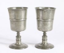 A pair of George II pewter communion cups, circa 1750 Each having a deep bowl, with mid-fillet and