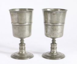A pair of George II pewter communion cups, circa 1750 Each having a deep bowl, with mid-fillet and