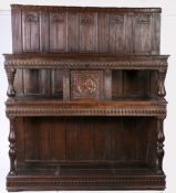A 16th century impressive oak court cupboard, French, circa 1560-80 Having a back of fifteen panels,