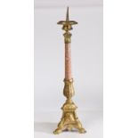 A 18th century style gilt metal pricket candlestick, having a gadrooned flange above a acanthus leaf