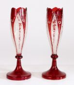 A pair of late 19th century Bohemian tulip vases, circa 1880, having red stained and floral
