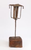 Iron and timber hanging lamp holder, possible for cruise lamps, with a platform and cage above a