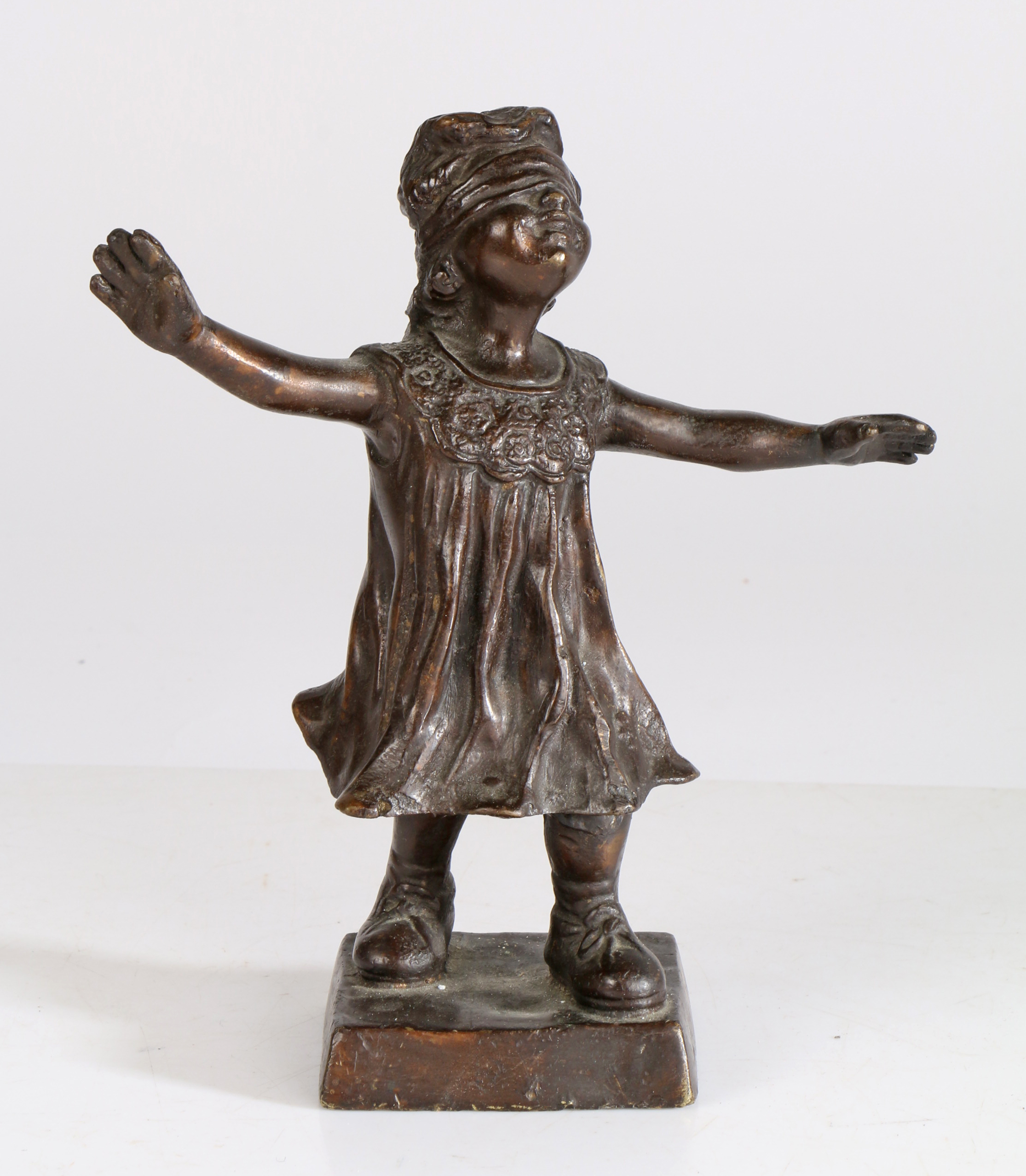A late 19th/20th century bronze figure of a blindfolded girl, depicting a girl wearing a blindfold