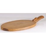 A Robert "Mouseman" Thompson chopping board, the oval board with a handle set with a mouse, 39cm