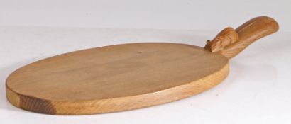 A Robert "Mouseman" Thompson chopping board, the oval board with a handle set with a mouse, 39cm