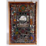 An interesting stained glass window formed of various panels to include 17th century panels which