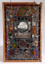 An interesting stained glass window formed of various panels to include 17th century panels which