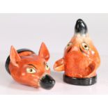 A pair of 19th century Staffordshire fox stirrup cups, formed as a red fox with a black collar, 12.