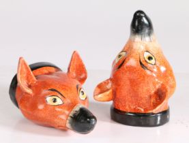 A pair of 19th century Staffordshire fox stirrup cups, formed as a red fox with a black collar, 12.