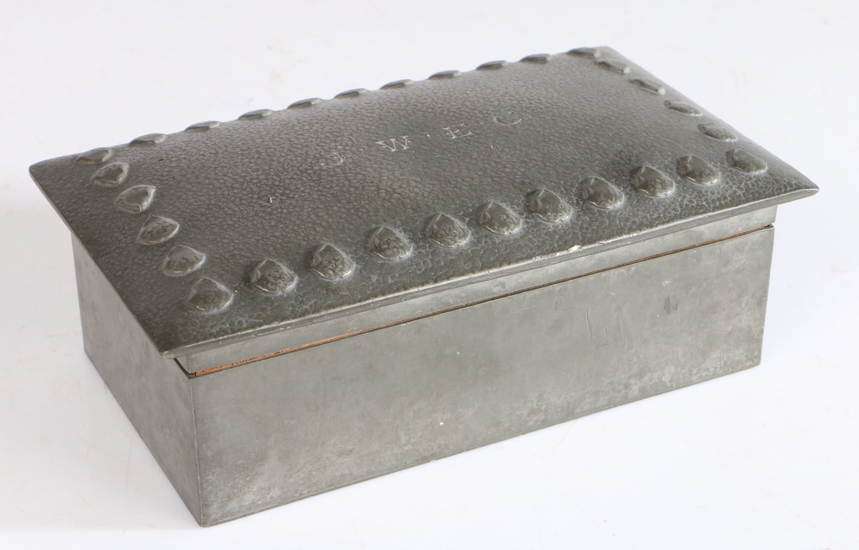 An Arts & Crafts Solkets for Liberty & Co pewter box, shape 0124, having a mottled lid with J.W.E.
