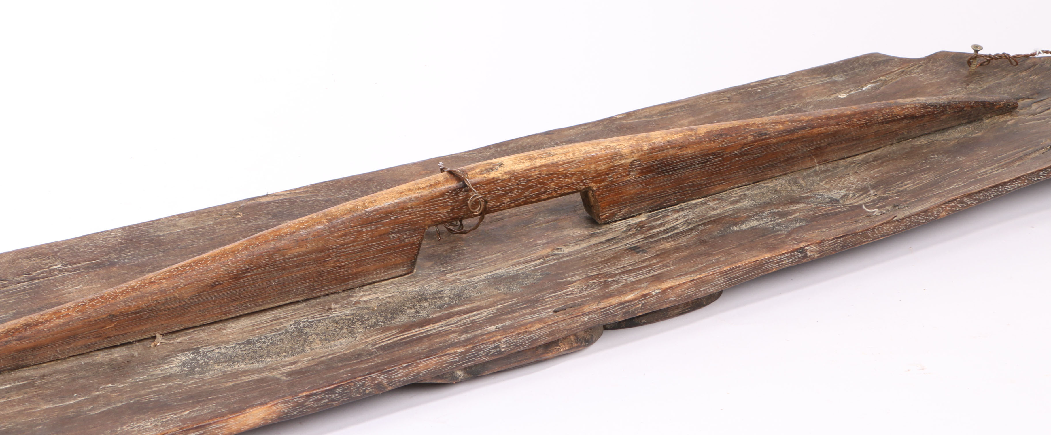 An Dayak wooden shield carved with a demons face, Borneo, having a demons face to centre and - Image 2 of 2