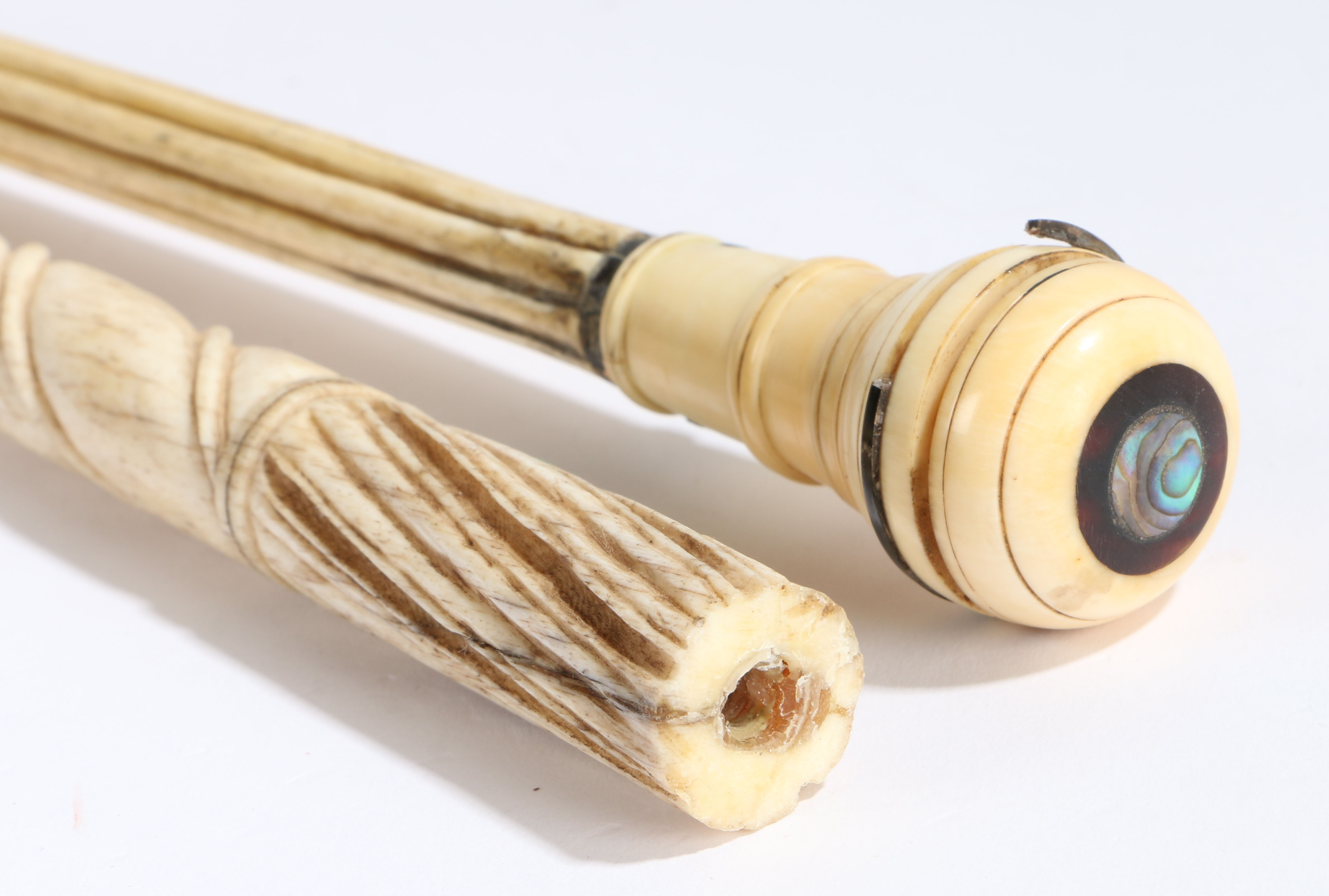 Two 19th century whalebone walkingsticks, one having a reeded and spiral carved column with a baleen - Image 2 of 3