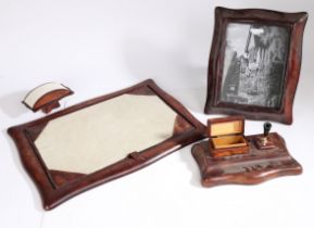 A 20th Century desk set, with a blotter, frame, pad, ink well, (5)