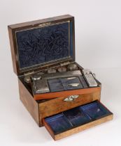 A 19th century walnut vanity box, having a mother of pearl inlaid cartouche, the interior set with