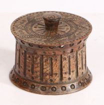 A oak treen lidded pot, with ring decoration and a turned knob, 7cm high