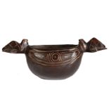 A South Sea hardwood bowl, having two handles in the form of turtles and a carved body, possibly