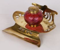 An Art Nouveau Loetz art glass inkwell, Austrian circa 1900, the ruby glass with a wavy design to