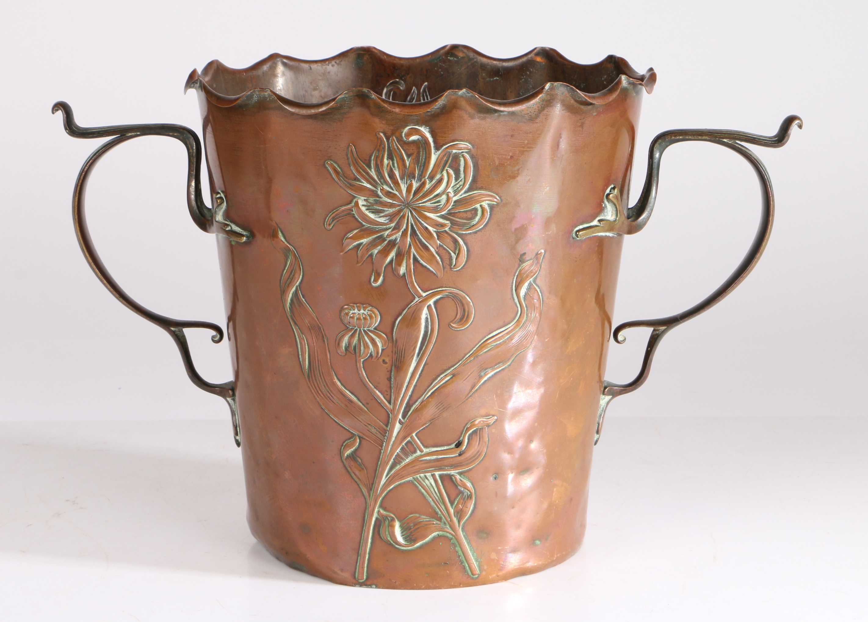 Carl Deffner (German 1856-1948) an Art Nouveau copper twin handled jardiniere, having a wavy