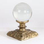 A 19th century crystal ball set on a gilt bronze stand in the Rococo manner, 17cm high