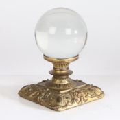 A 19th century crystal ball set on a gilt bronze stand in the Rococo manner, 17cm high