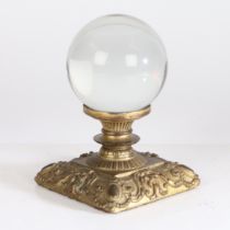 A 19th century crystal ball set on a gilt bronze stand in the Rococo manner, 17cm high