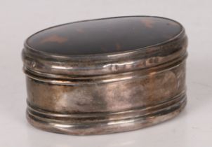 A George V silver and tortoiseshell box, of oval form and having rings to the body, hallmarked