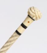 A 19th century whalebone tortoiseshell and inalid walking stick, the handle carved as a trinity knot